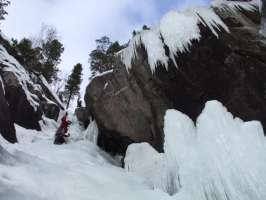 Spectacular ice formations at the top (P4) of Tjonnstadbergfossen, Dave & Al in view  [Andy Stratford]