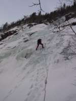 Jim on the third of the five full length abseils off Fabrikkfossen (WI3)  [Andy Stratford]