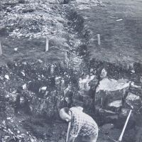 12 John Castick at work on septic tank excavations, Phil Kendell behind in discharge trench (note original compound wall at full height) (Derek Seddon Collection)