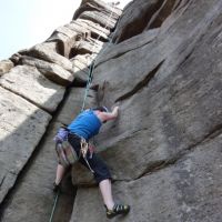 Jo Stratford on the tricky first moves of Hollybush Crack (Kat Lauer)