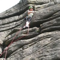 Emily triumphant on Stepladder Crack VS 5a (Roger Dyke)