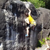 Gareth searching for the finishing hold on a slopey Bas Cuvier top-out (Daniel O'Brien)