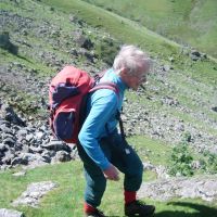 Roger Dyke approaching Glaciated Slabs. (Colin Maddison)