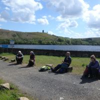 Mid-afternoon halt by Strines Reservoir, with Boot's Folly on the skyline (Dave Shotton)