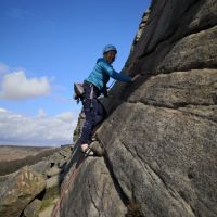 Caroline following Tom on the initial slab of Flying Buttress (Andy Stratford)