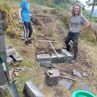 Kate Harvey and Pete Attwood making the first footing for the new stone steps to the knoll (Andy Stratford)