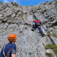 Stu tests the stretch properties of his trousers at Attermire (Caroline Gay)